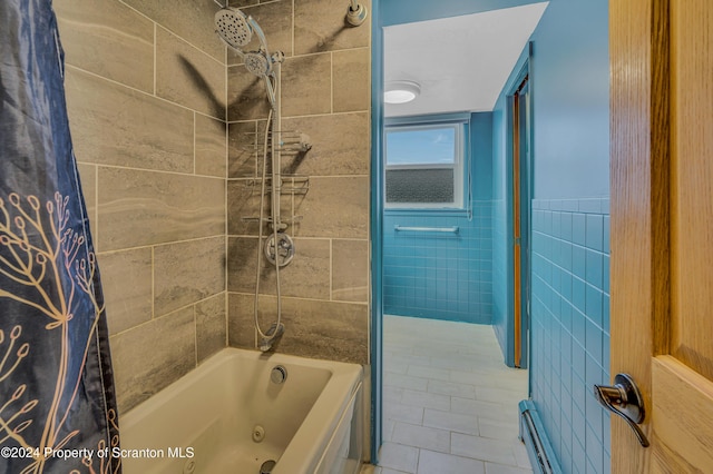 bathroom featuring tile patterned flooring, tiled shower / bath combo, and tile walls