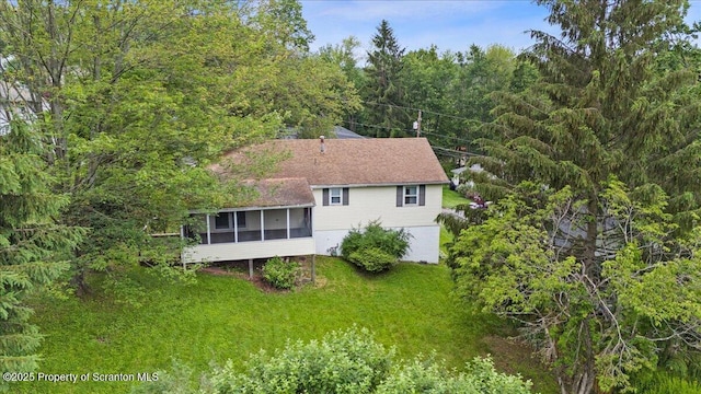 206 Florence Dr, Clarks Summit, PA 18411 - view of home's exterior with a sunroom and a wooded view