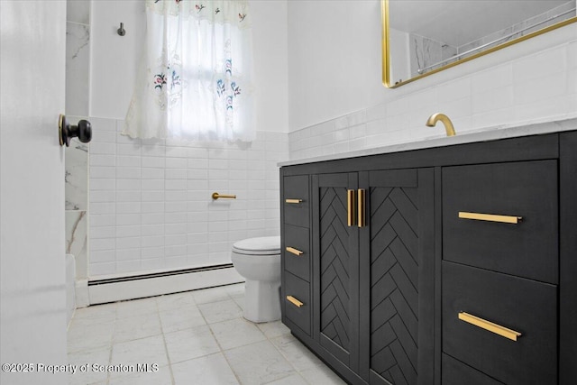 206 Florence Dr, Clarks Summit, PA 18411 - full bath featuring baseboard heating, tile walls, vanity, a shower, and a wainscoted wall