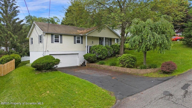 206 Florence Dr, Clarks Summit, PA 18411 - raised ranch featuring asphalt driveway, a garage, and brick siding