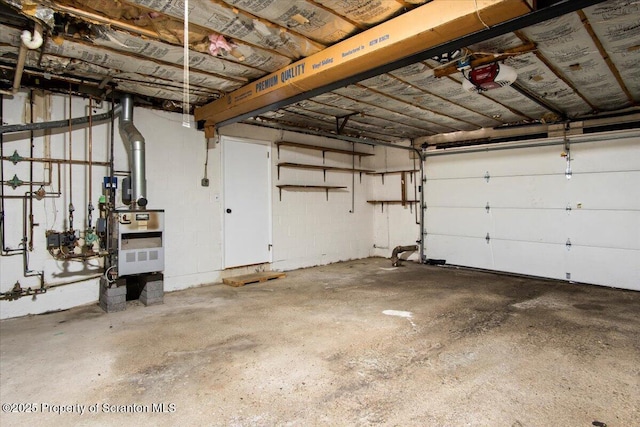 206 Florence Dr, Clarks Summit, PA 18411 - garage featuring a garage door opener and a heating unit