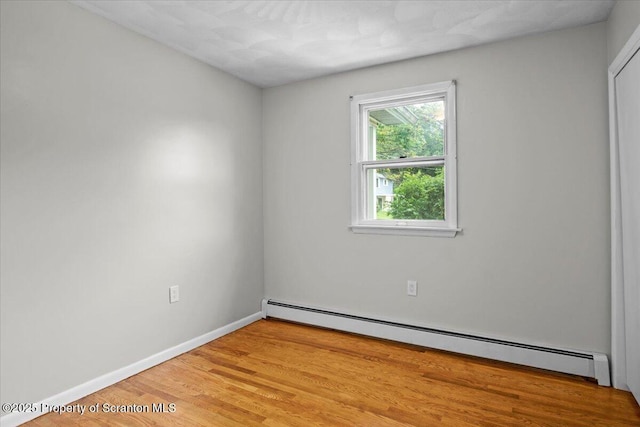 206 Florence Dr, Clarks Summit, PA 18411 - unfurnished room with a baseboard radiator and light wood-style flooring