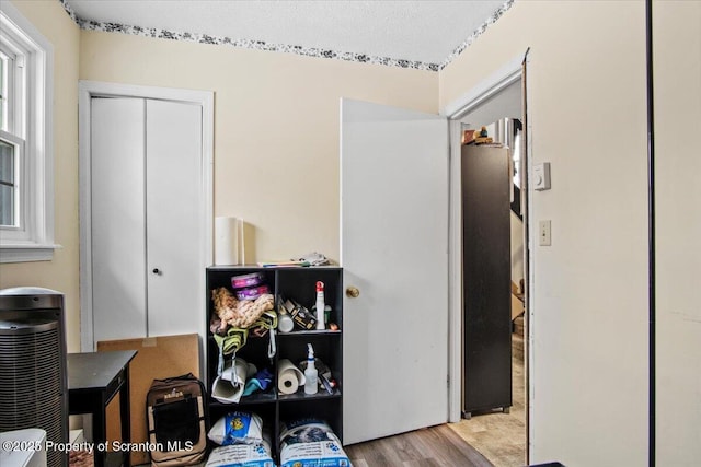 home office with light hardwood / wood-style floors