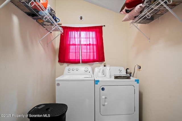 clothes washing area with washer and dryer