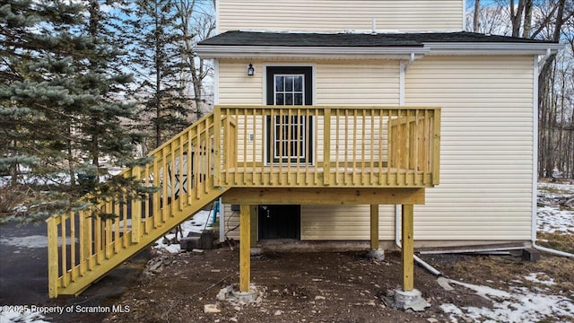 snow covered property featuring a wooden deck