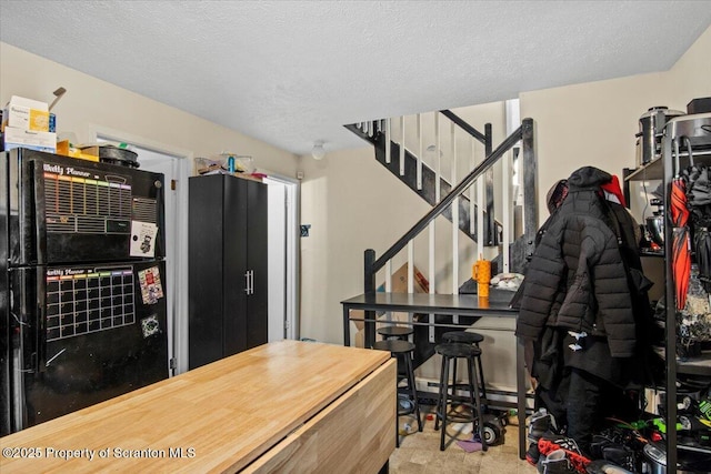 kitchen featuring a textured ceiling