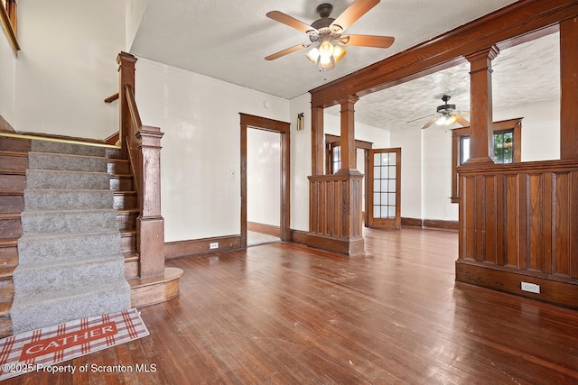 818 Cherry St, Scranton, PA 18505 - unfurnished living room with a ceiling fan, hardwood / wood-style flooring, stairs, and decorative columns