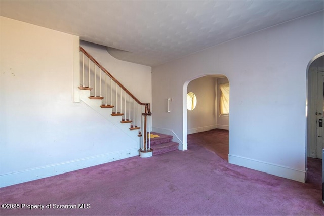 entryway featuring carpet flooring