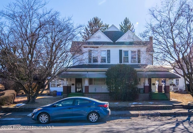 victorian home featuring covered porch