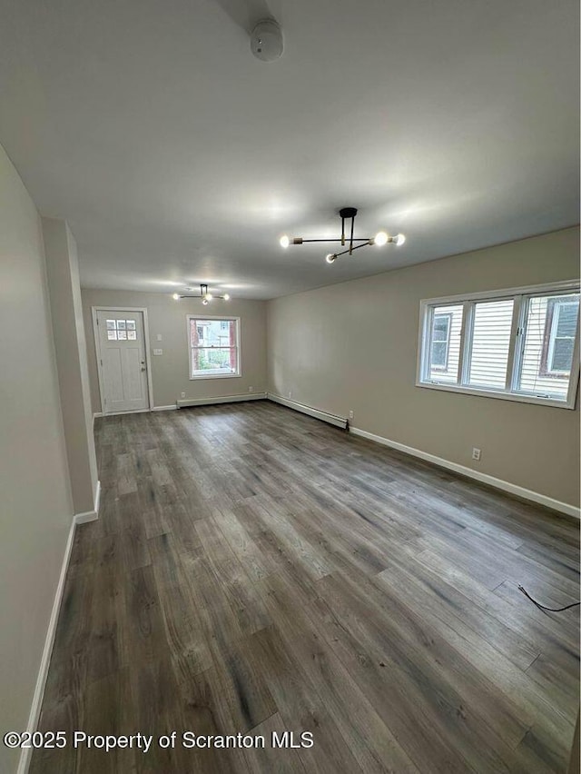 interior space featuring dark wood-style floors and baseboards