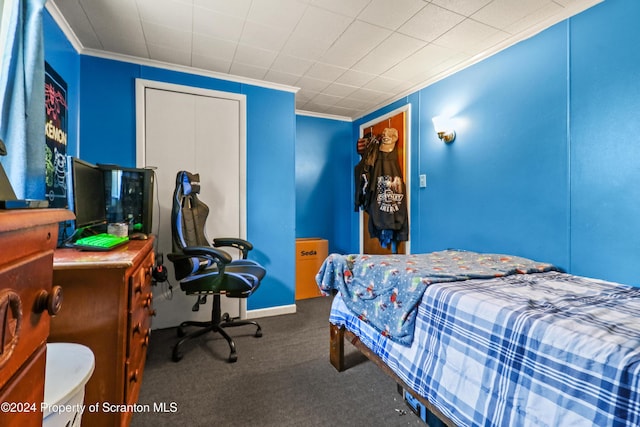 bedroom featuring dark colored carpet and crown molding