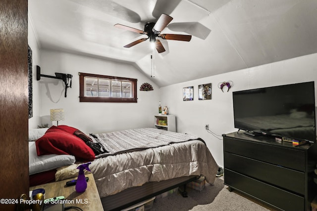 carpeted bedroom featuring ceiling fan and lofted ceiling