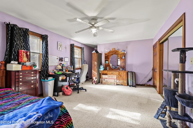 carpeted bedroom featuring ceiling fan