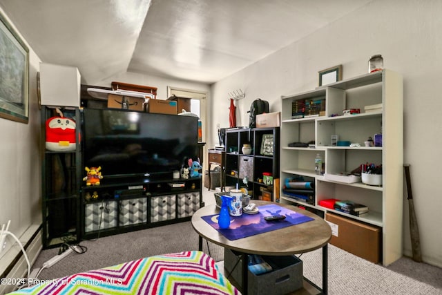 carpeted living room with lofted ceiling and baseboard heating