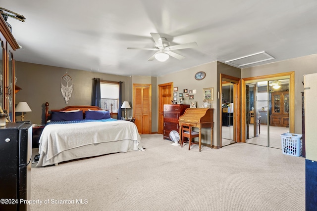 bedroom featuring two closets and ceiling fan