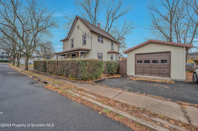 view of home's exterior with an outbuilding and a garage