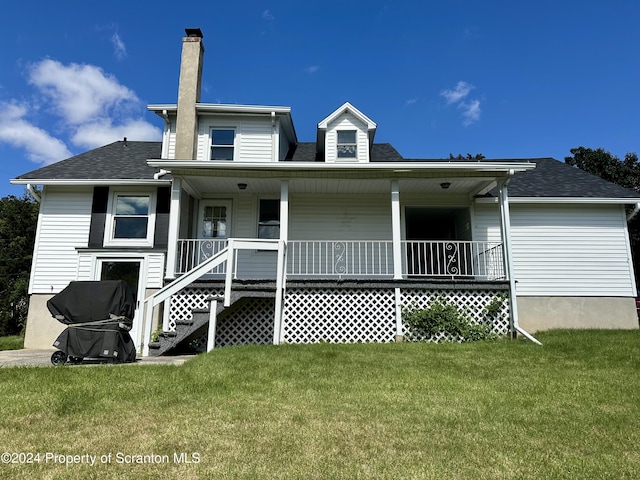 1402 Cherry St, Scranton, PA 18505 - rear view of house featuring a chimney, a porch, a lawn, and roof with shingles