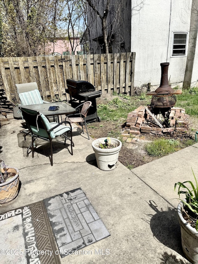 view of patio / terrace featuring fence