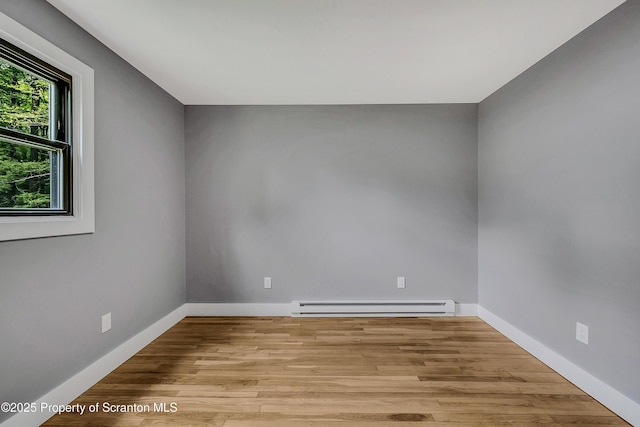 40 Honey Bear Rd, Lake Ariel, PA 18436 - unfurnished room with a baseboard radiator, wood finished floors, and baseboards