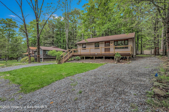 40 Honey Bear Rd, Lake Ariel, PA 18436 - view of front of house with a wooden deck and a front lawn
