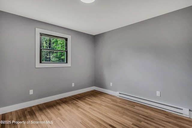 40 Honey Bear Rd, Lake Ariel, PA 18436 - empty room featuring a baseboard radiator, wood finished floors, and baseboards