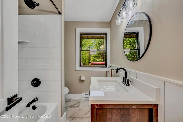 40 Honey Bear Rd, Lake Ariel, PA 18436 - full bathroom with marble look tile flooring, toilet, tub / shower combination, a baseboard radiator, and vanity