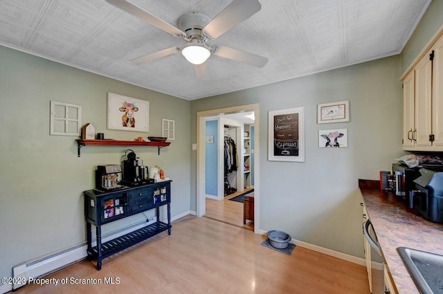 interior space featuring ceiling fan and light hardwood / wood-style flooring