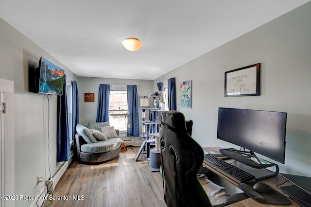 office area featuring wood-type flooring and baseboard heating