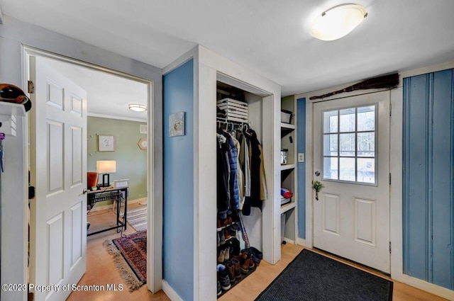 mudroom with light hardwood / wood-style floors