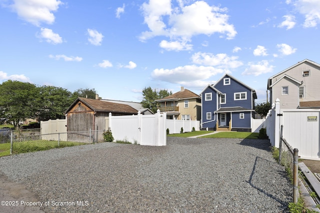 1210 N N Main Ave, Scranton, PA 18508 - view of front facade featuring driveway, a fenced backyard, and a residential view