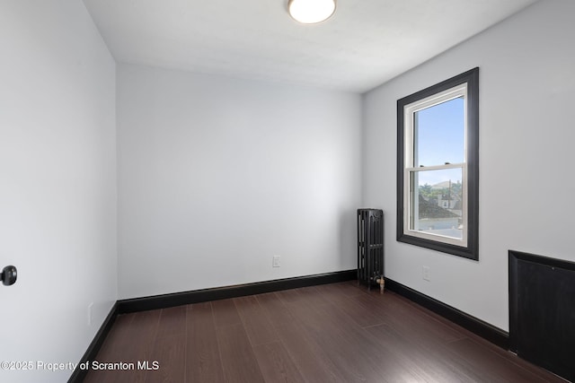 1210 N N Main Ave, Scranton, PA 18508 - spare room with radiator and dark wood-style flooring