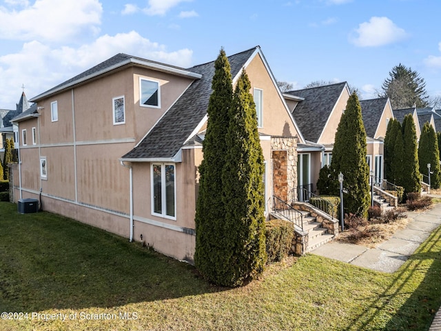 view of property exterior featuring a yard