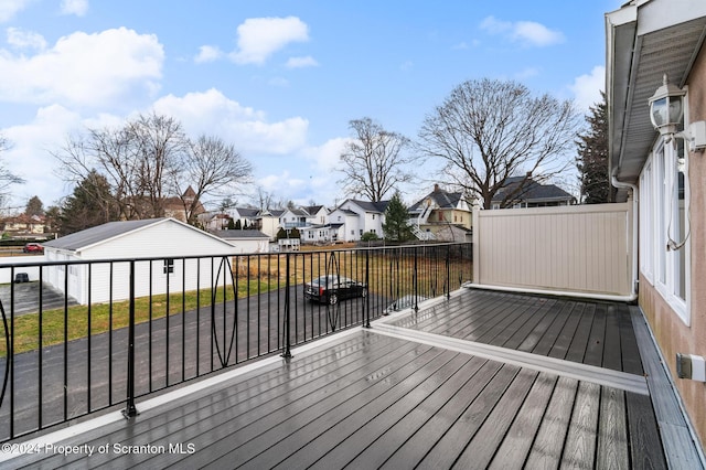 wooden terrace with a yard