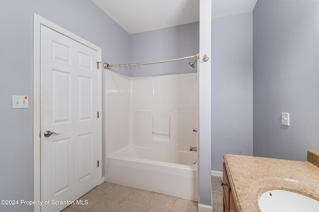 bathroom featuring vanity, tile patterned floors, and shower / washtub combination