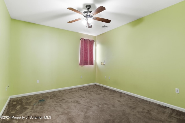 empty room with ceiling fan and carpet floors