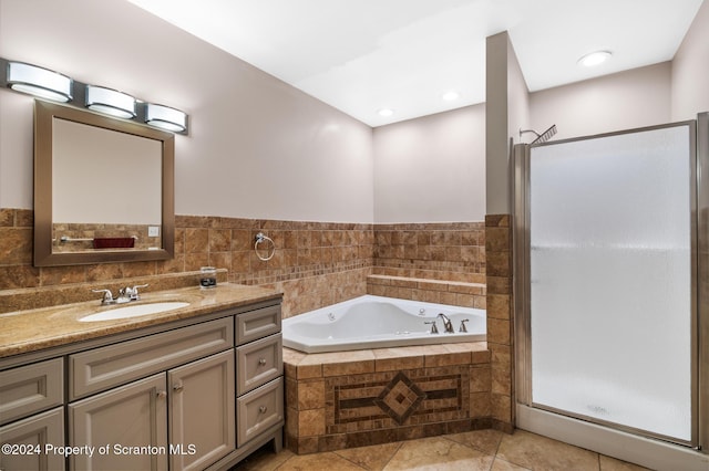 bathroom with separate shower and tub, tile patterned floors, and vanity