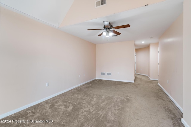 empty room with ceiling fan and carpet floors