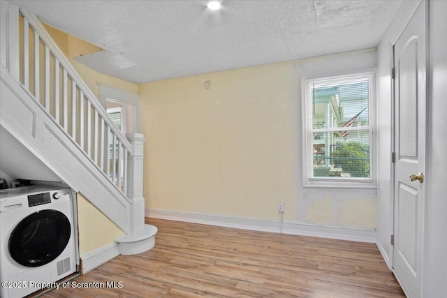 1017 W Market St, Scranton, PA 18508 - washroom featuring washer / clothes dryer, light wood-type flooring, and a textured ceiling