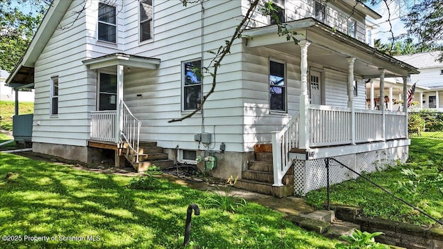 1017 W Market St, Scranton, PA 18508 - view of property exterior featuring covered porch and a yard