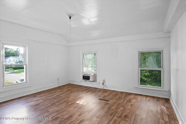 1017 W Market St, Scranton, PA 18508 - empty room featuring wood finished floors, cooling unit, and vaulted ceiling