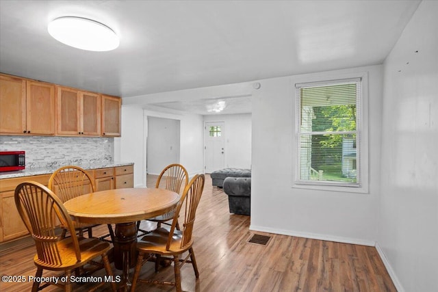 1017 W Market St, Scranton, PA 18508 - dining area with baseboards and wood finished floors