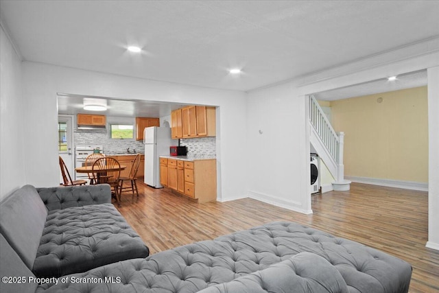 1017 W Market St, Scranton, PA 18508 - living room featuring light wood-style floors, stairway, and recessed lighting