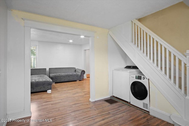 1017 W Market St, Scranton, PA 18508 - laundry room with wood finished floors and washing machine and dryer