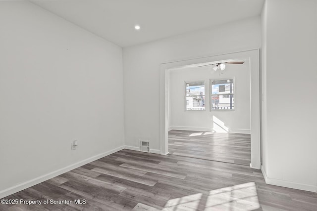 spare room featuring ceiling fan and light wood-type flooring