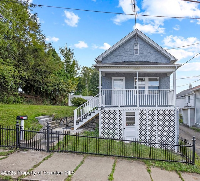 view of front facade featuring a front lawn and a porch