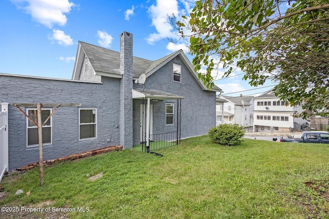 exterior space featuring a front lawn