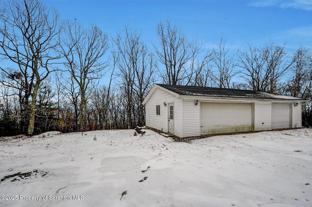 view of snow covered garage