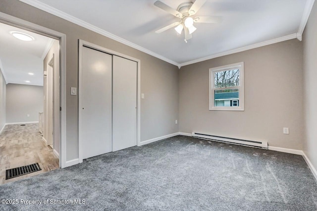 unfurnished bedroom featuring ceiling fan, a closet, ornamental molding, and a baseboard radiator