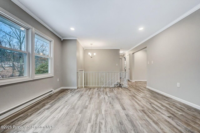 unfurnished room featuring crown molding, a baseboard radiator, light wood-type flooring, and an inviting chandelier