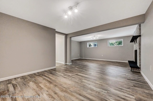 unfurnished living room with hardwood / wood-style floors